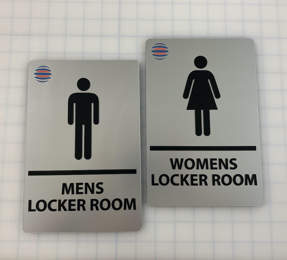 Branded bathroom signs for local community.